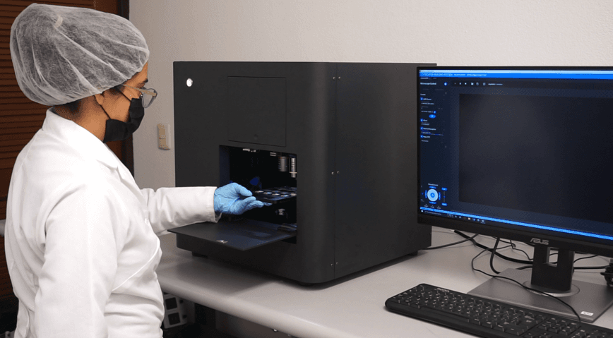 Lab technician operating the imaging system
